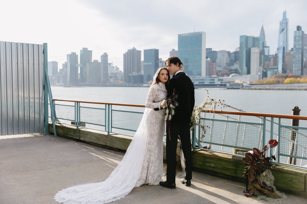 meredith-michel-editorial-wedding-couple-embracing-waterfront