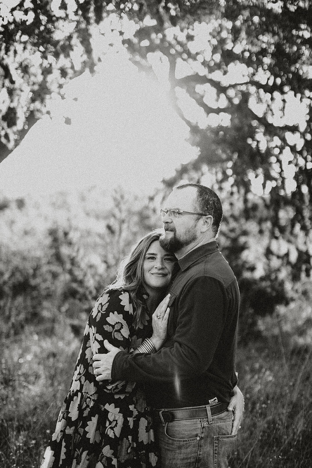 Black and white couple portrait outdoors in beautiful natural light - Sara James San Antonio photographer creates romantic artistic imagery capturing love and connection with classic monochrome style in Texas