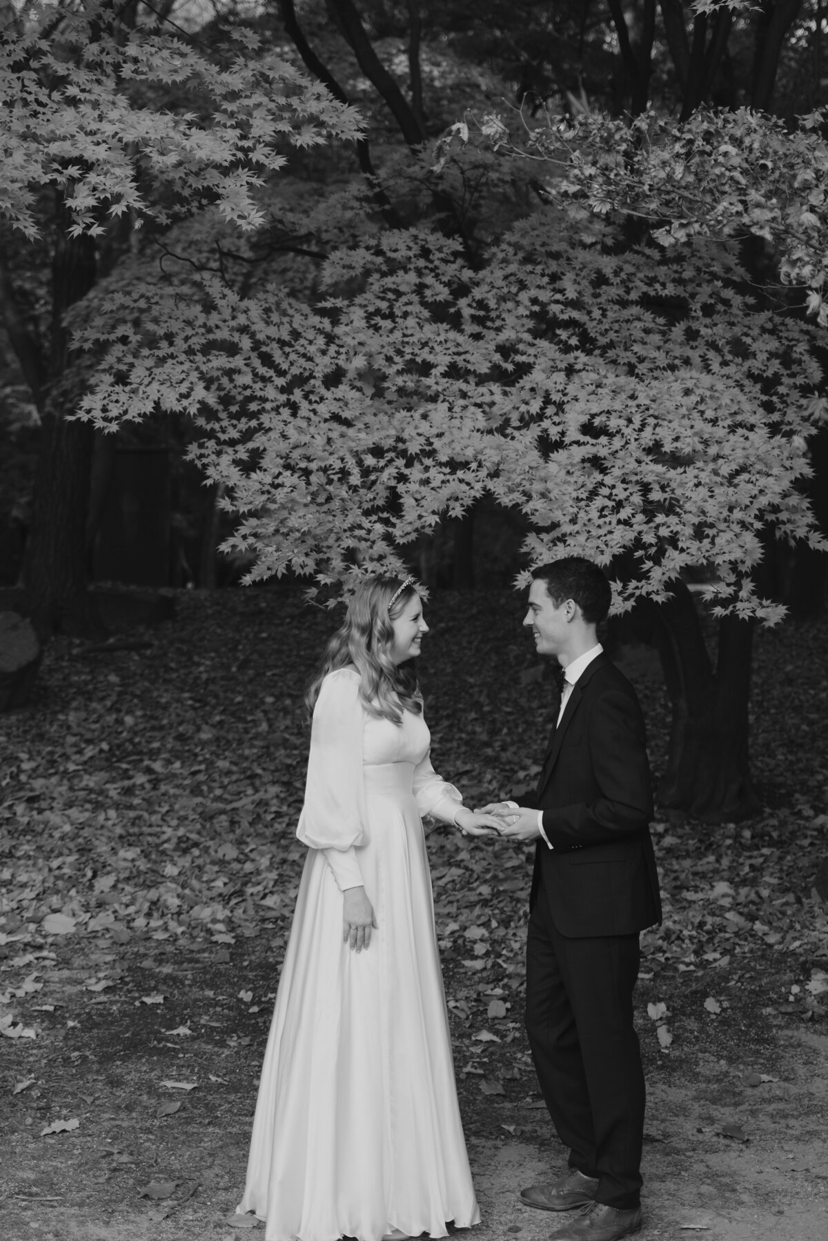 the groom putting the wedding ring to the bride