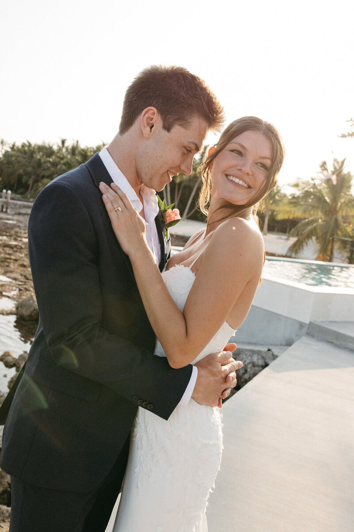 Bride and groom embracing for wedding photos by wedding photographers in orlando florida
