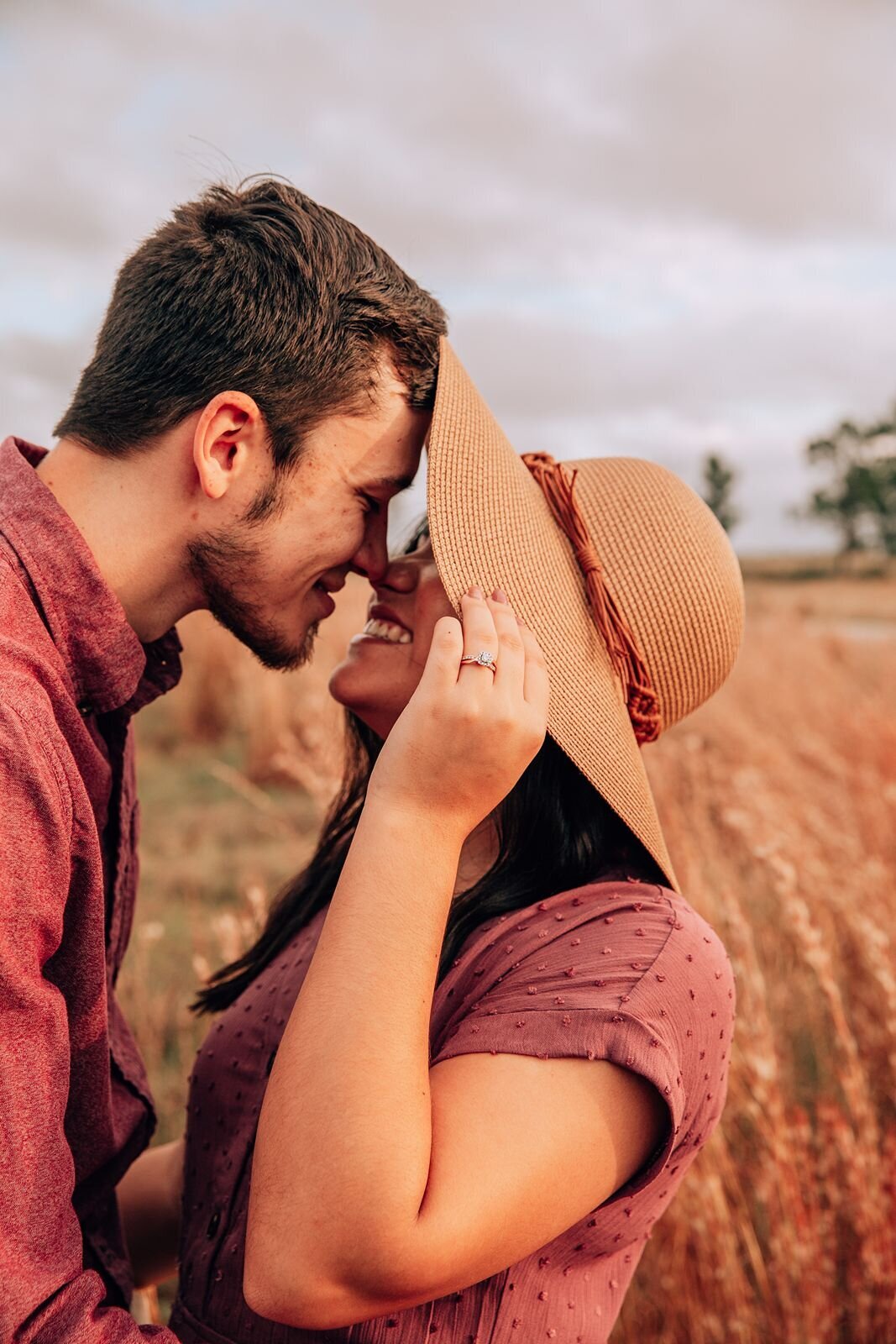 candid moment of couple smiling before kissing