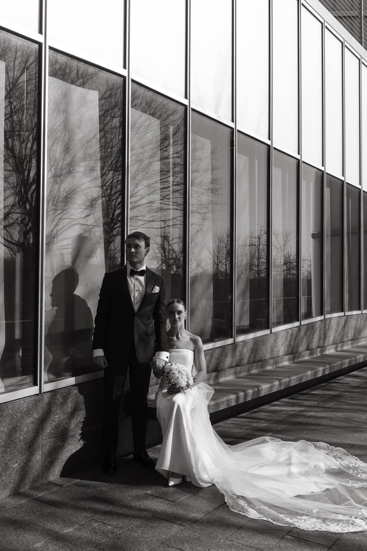 Luxury and bold wedding couple portrait by luxury wedding photographer Staci Brucks showcasing wedding dress details