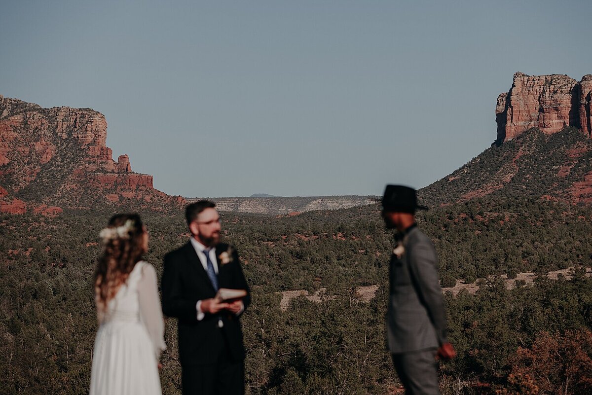 wedding ceremony with the sedona red rocks in the background