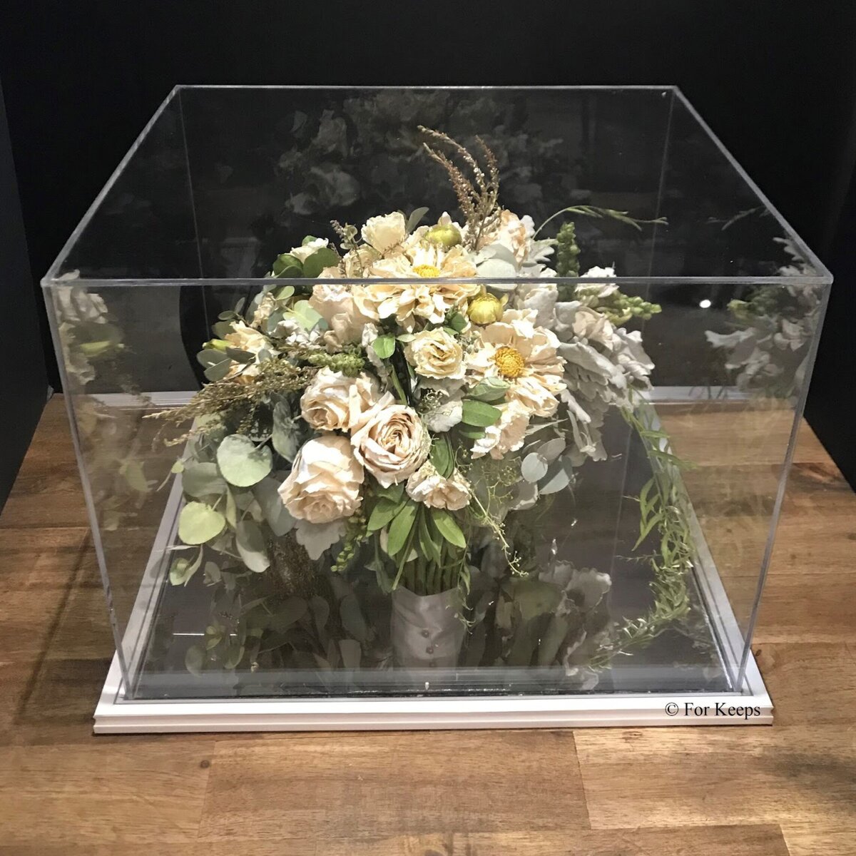 Wedding bouquet preserved inside perspex keepsake.