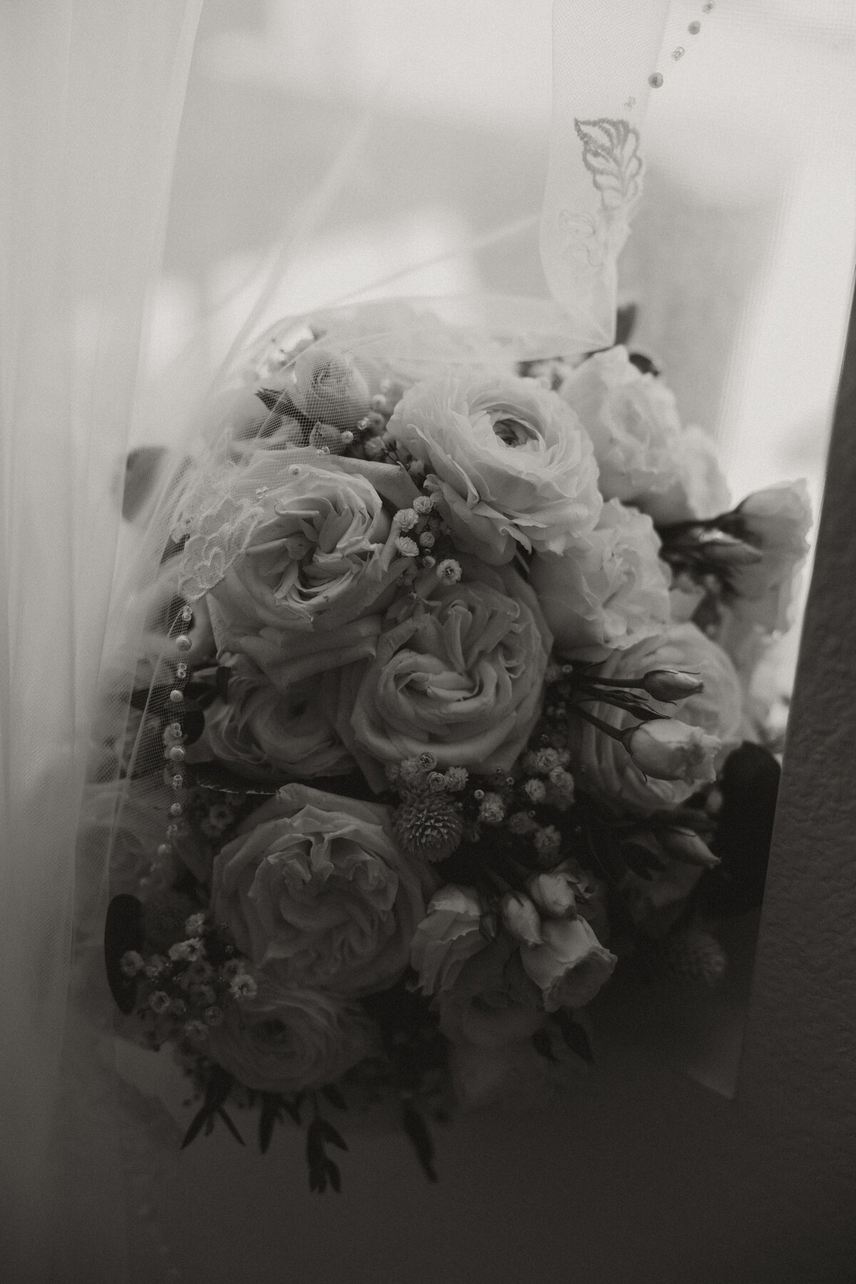 wedding bouquet with veil, black and white detail photo