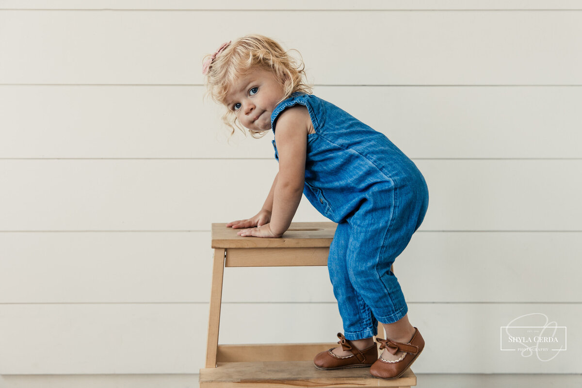 Baby girl playing in studio
