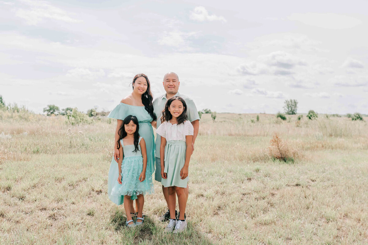 A mom and dad and their 2 girls. 