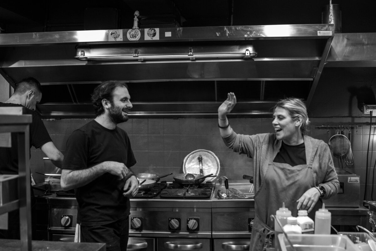 Black and white photo of chefs celebrating.