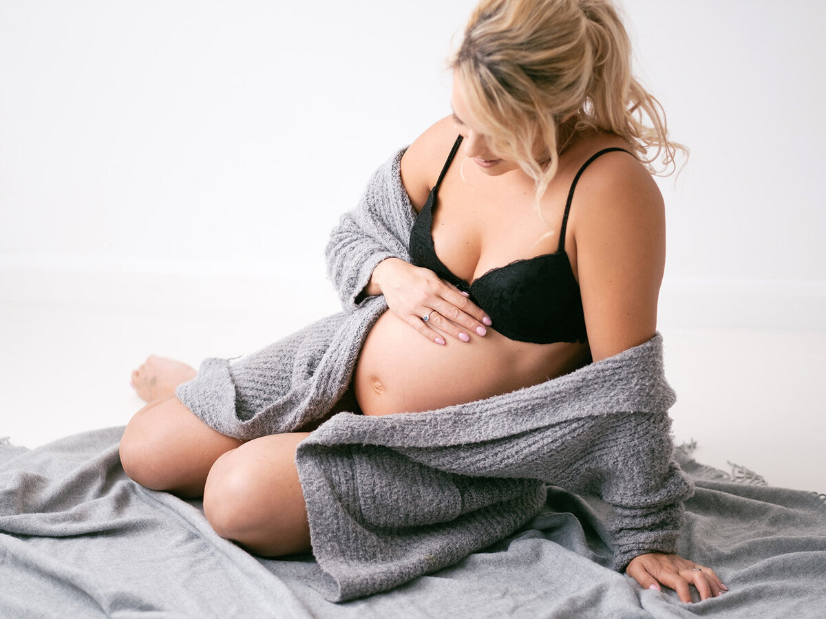 Pregnant woman relaxes in a blanket