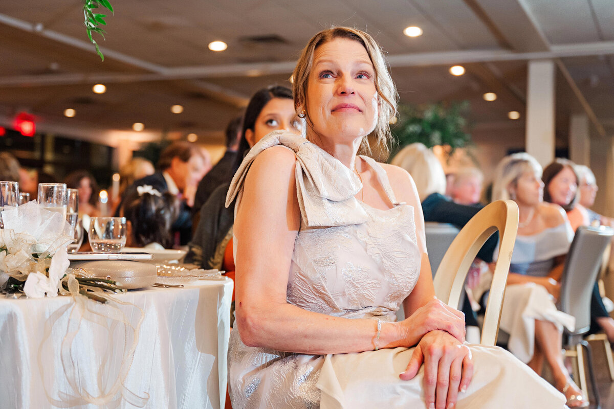 mother of the bride listening to wedding toast