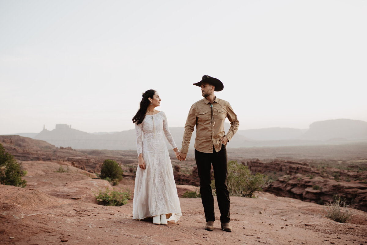 Utah Elopement Photographer captures groom wearing cowboy hat at Moab wedding