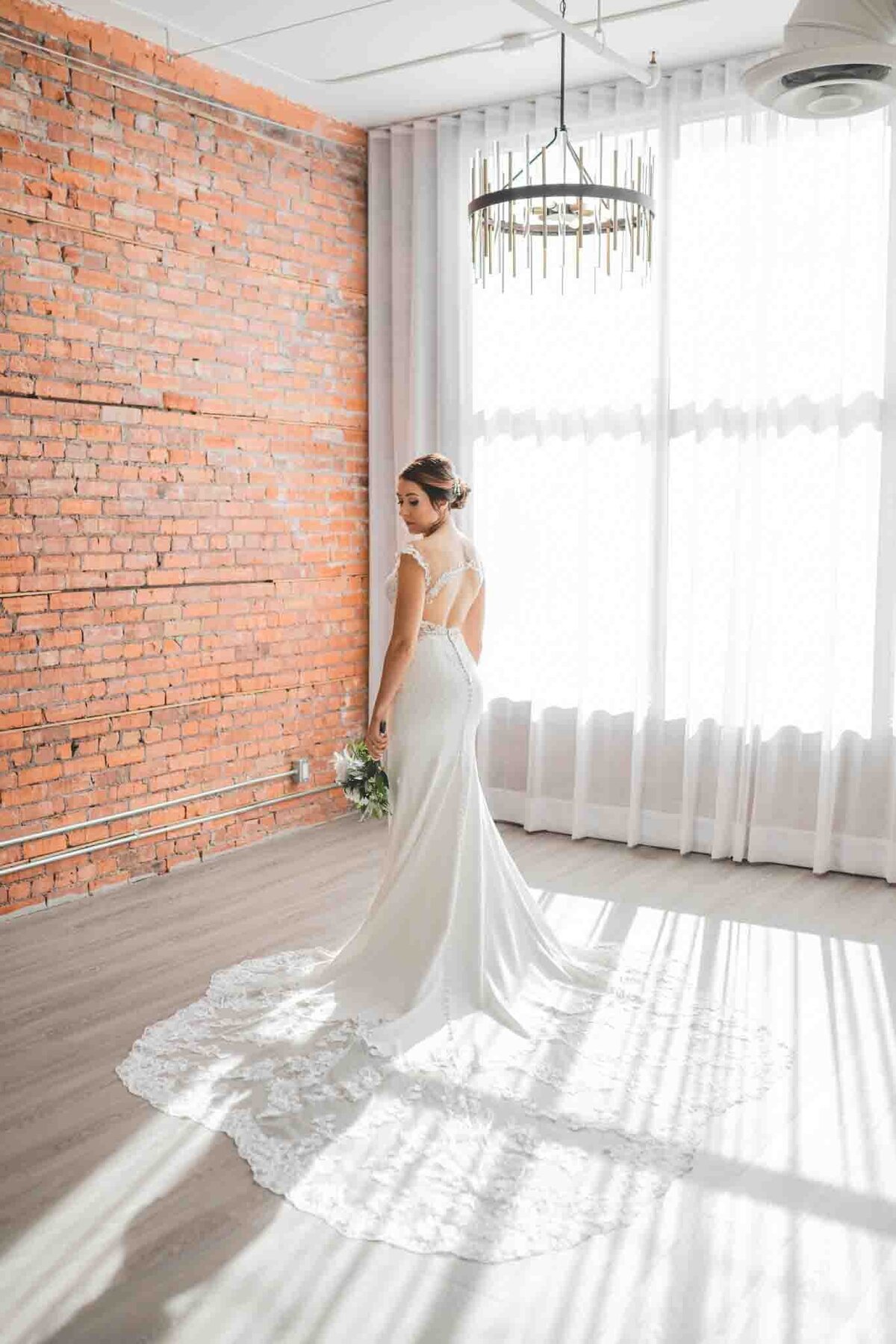 Stunning bridal portrait at Venue 308, a historical warehouse wedding venue in Calgary, featured on the Brontë Bride Vendor Guide.