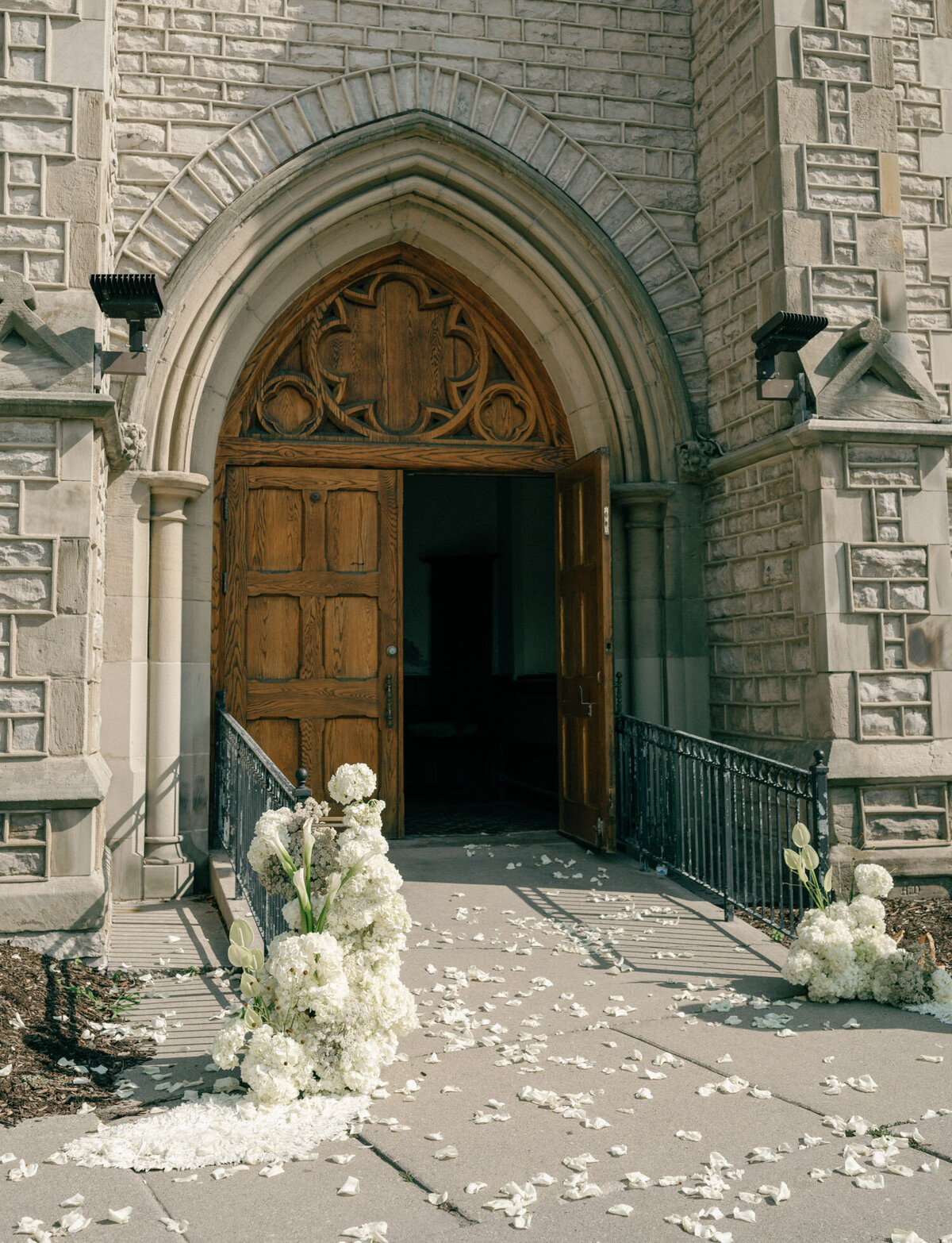 petal toss aftermath, white petals scattered outside Christ Church, Detroit