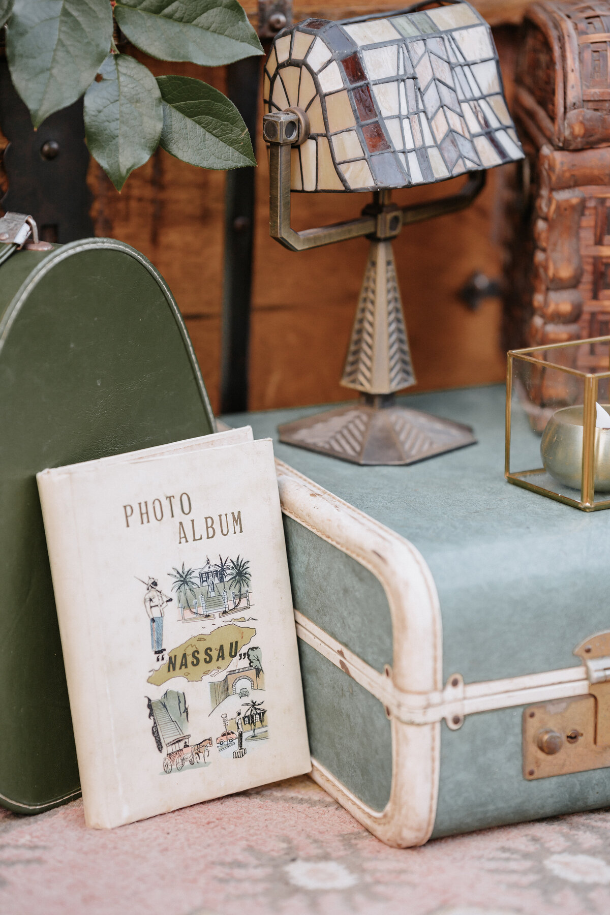 vintage trunk, lamp and photo album decor