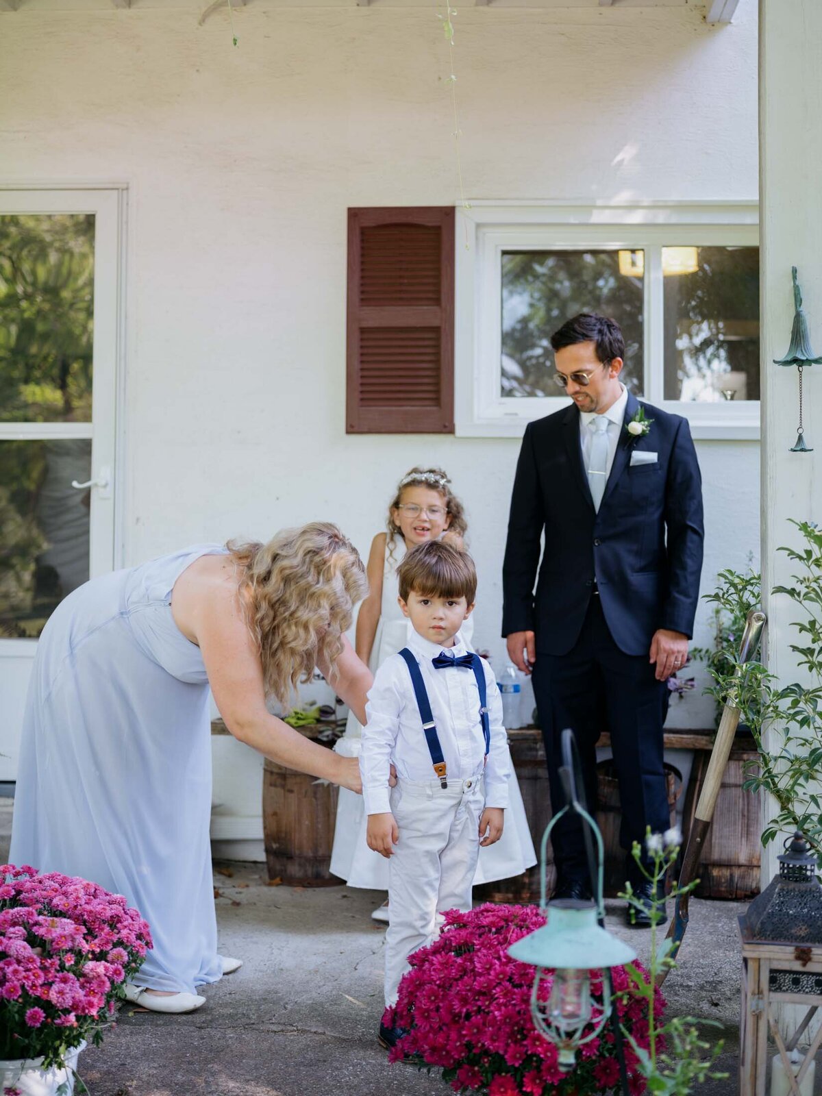 Family getting ready for a backyard wedding