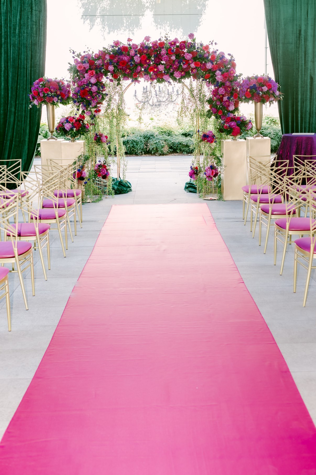 secret-garden-wedding-red-purple-flowers-greenery-arch-pink-aisle