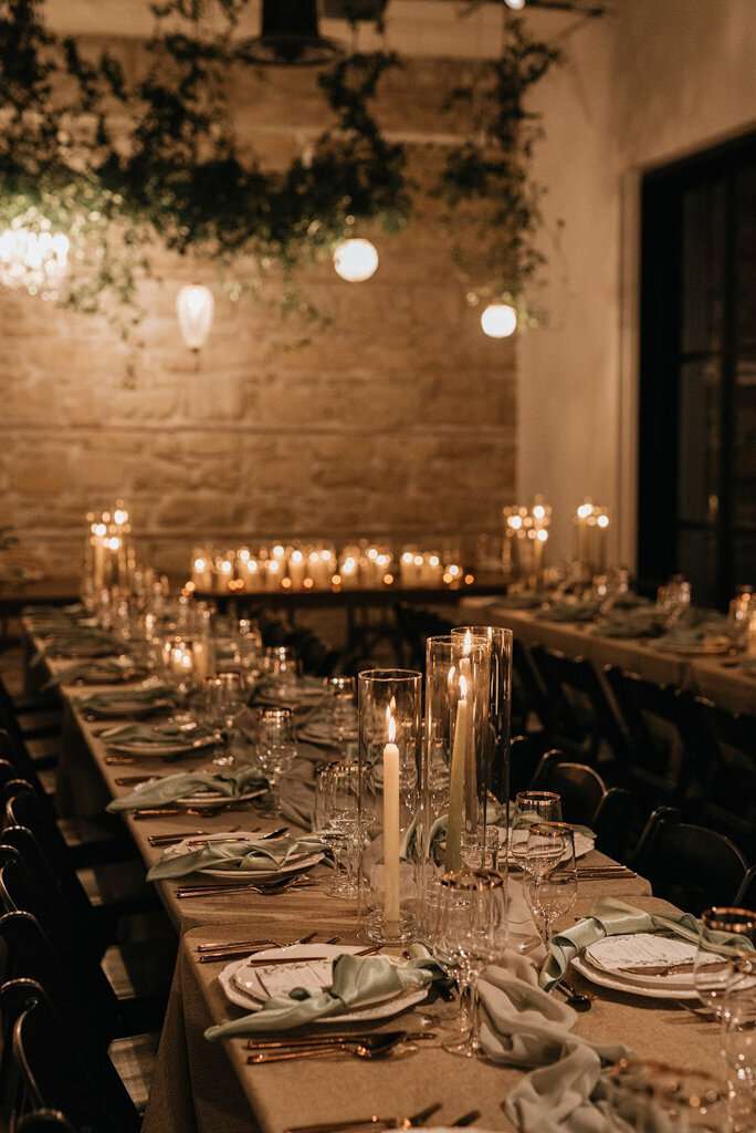 Indoor reception at The Pioneer, a historical industrial wedding venue in Calgary, featured on the Brontë Bride Vendor Guide.