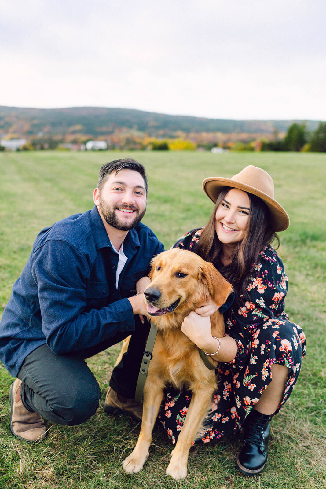 couple-with-their-golden-retreiver-dog