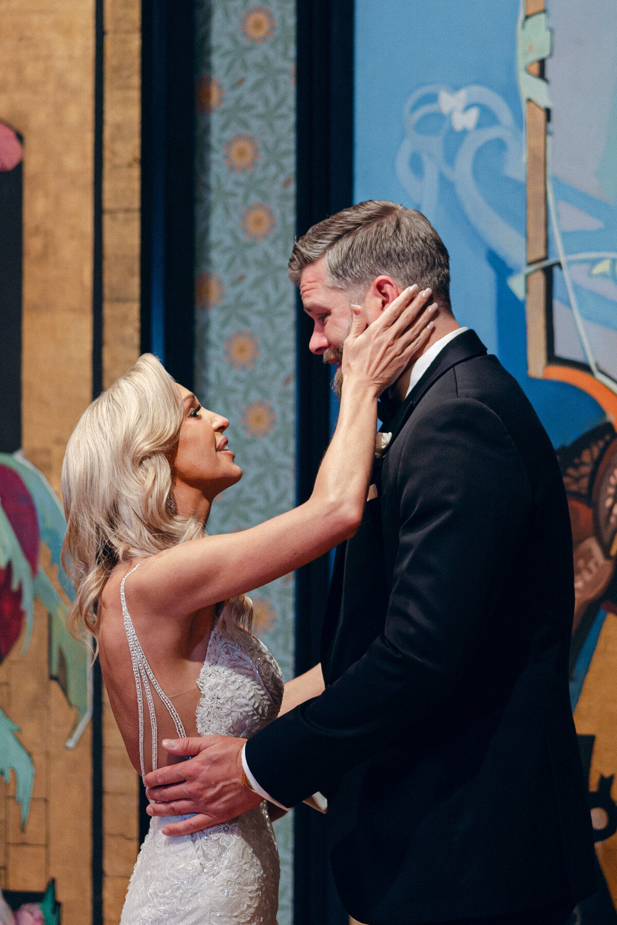 A wedding day photo of the bride & groom during their first look, at Crystal Bridges Museum of American  Art in Arkansas