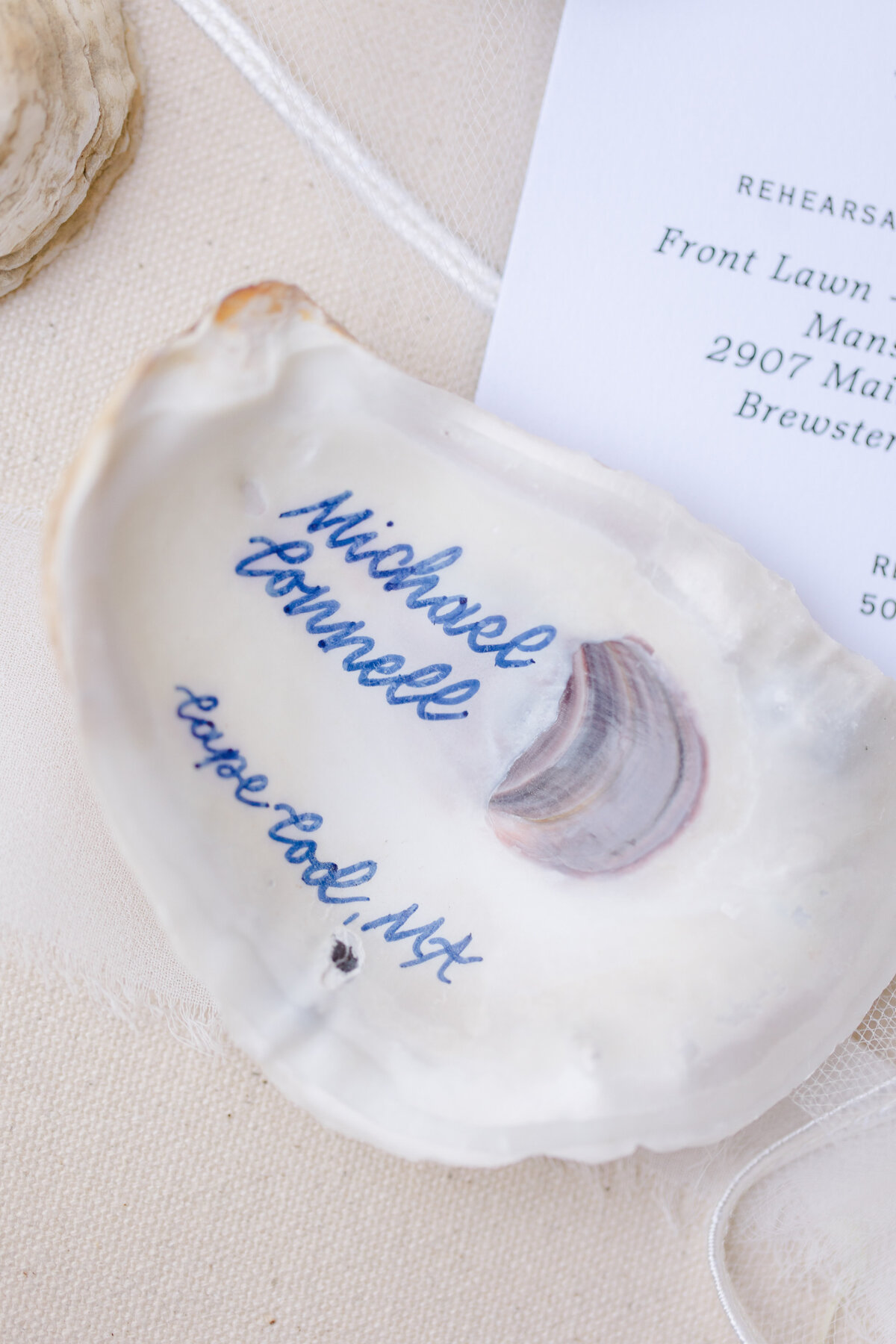 Custom oyster shell place card with guest name
