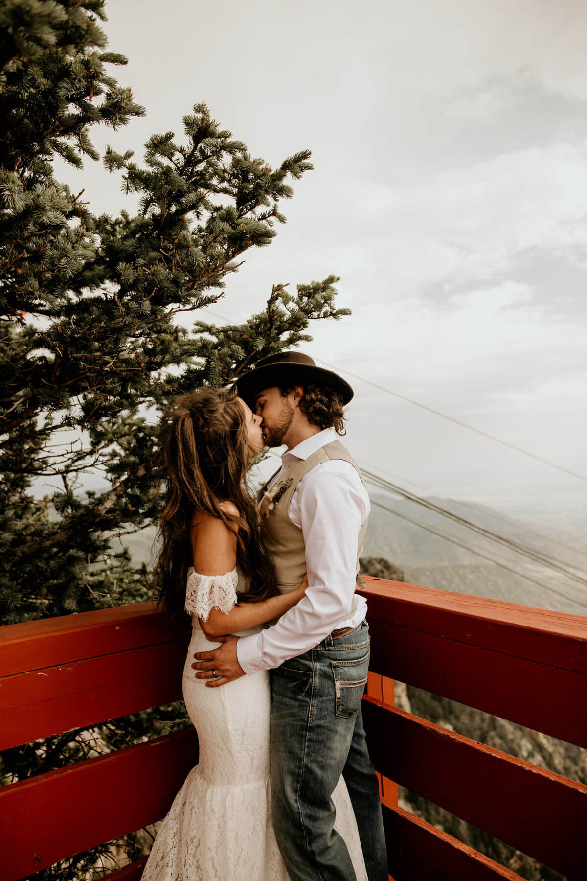 bride and groom kissing at the sandia peak tram in Albuquerque