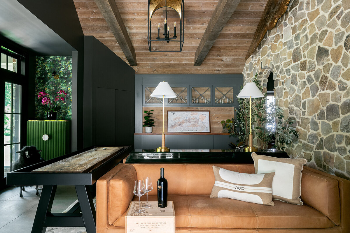 lounge area with stone accent wall