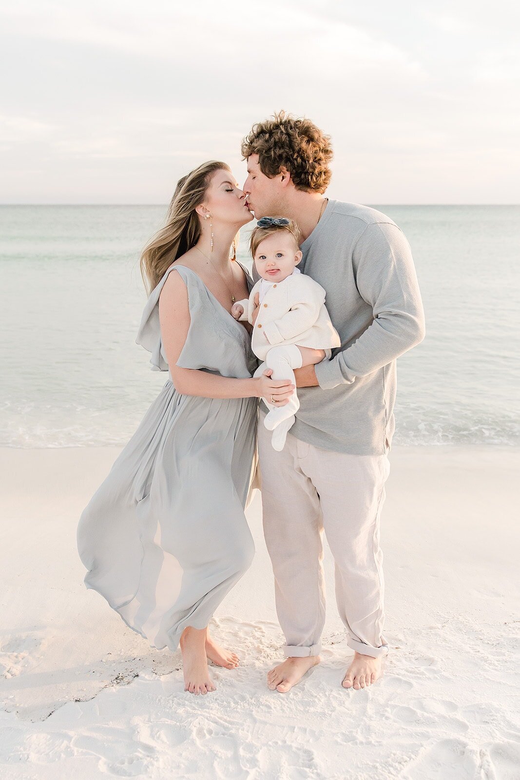 a couple kissing at a destin beach photographed by family photographer
