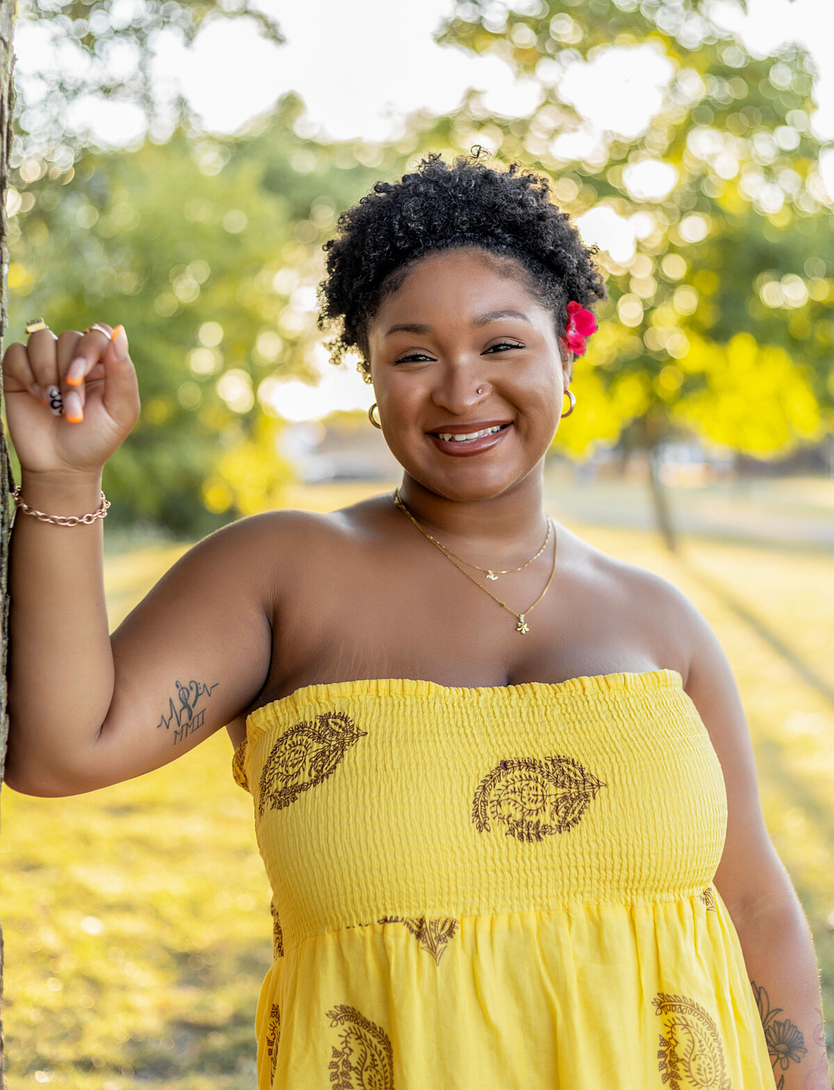 African American woman with natural hair and red flower in hair