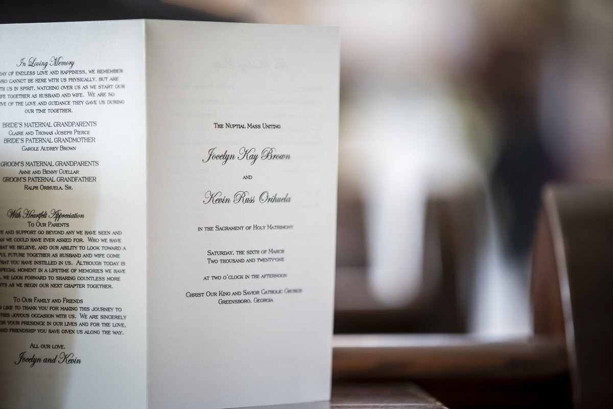 Nuptials brochure with bride and grooms name on it.