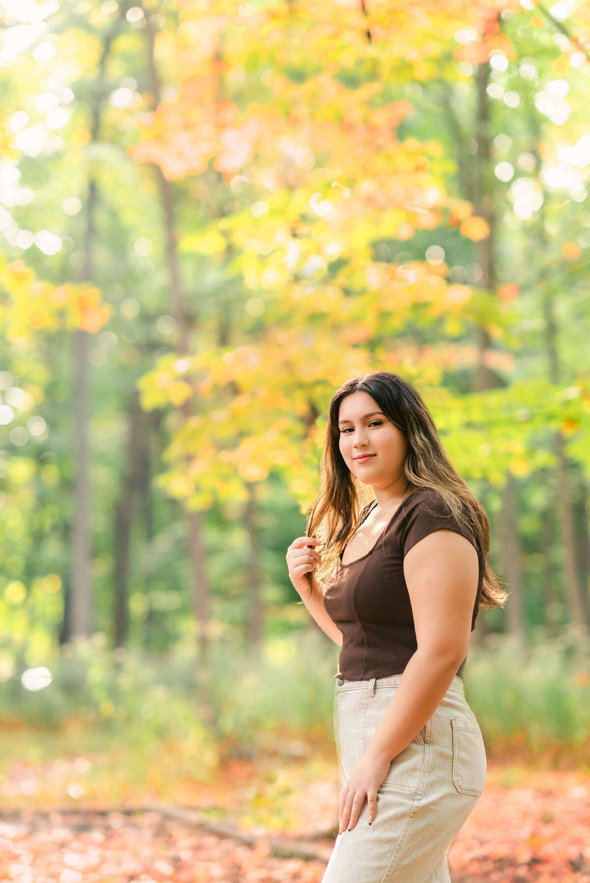 Latina senior in the fall woods