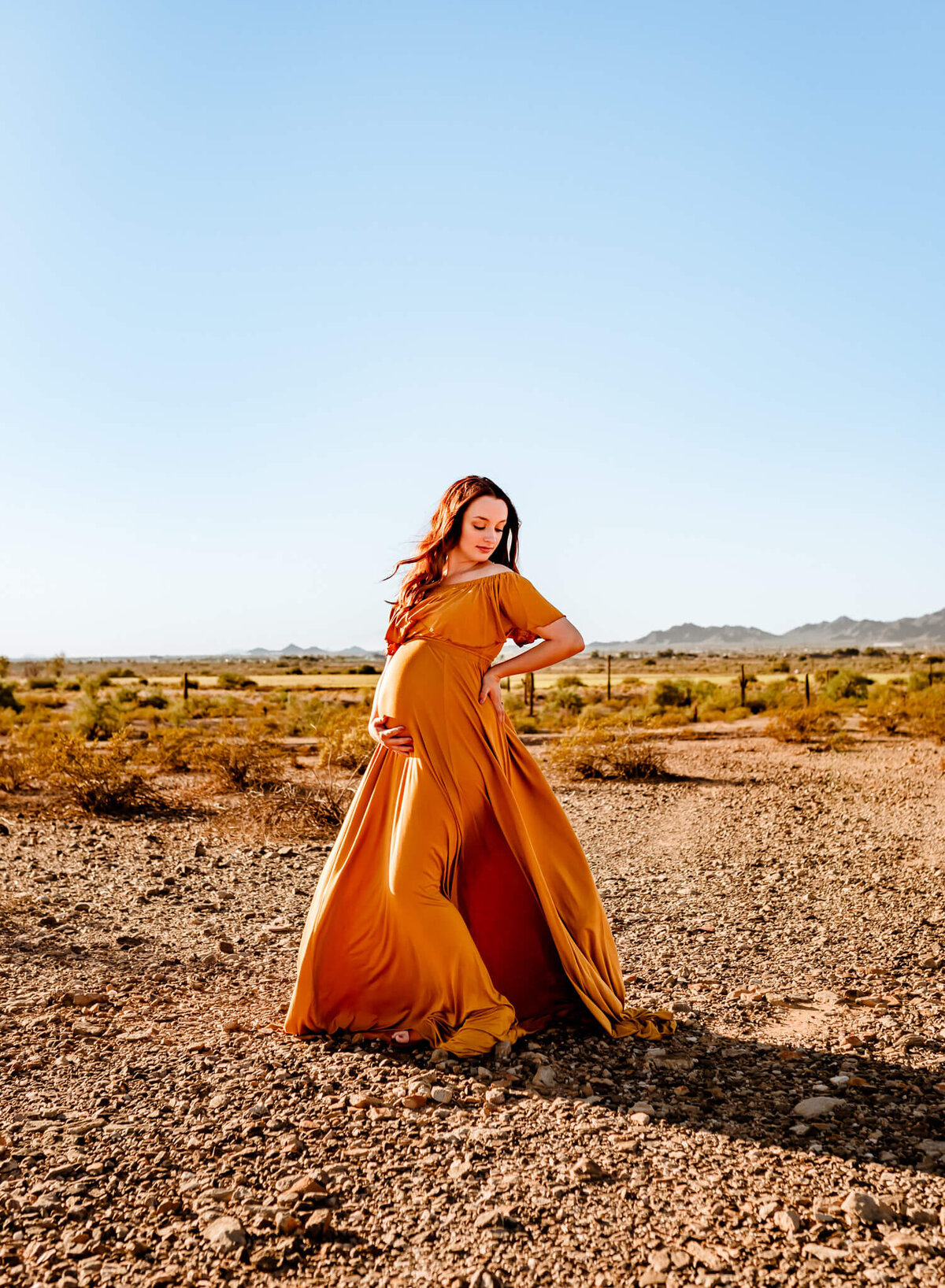 Mom posing for her maternity session with Arizona photographer