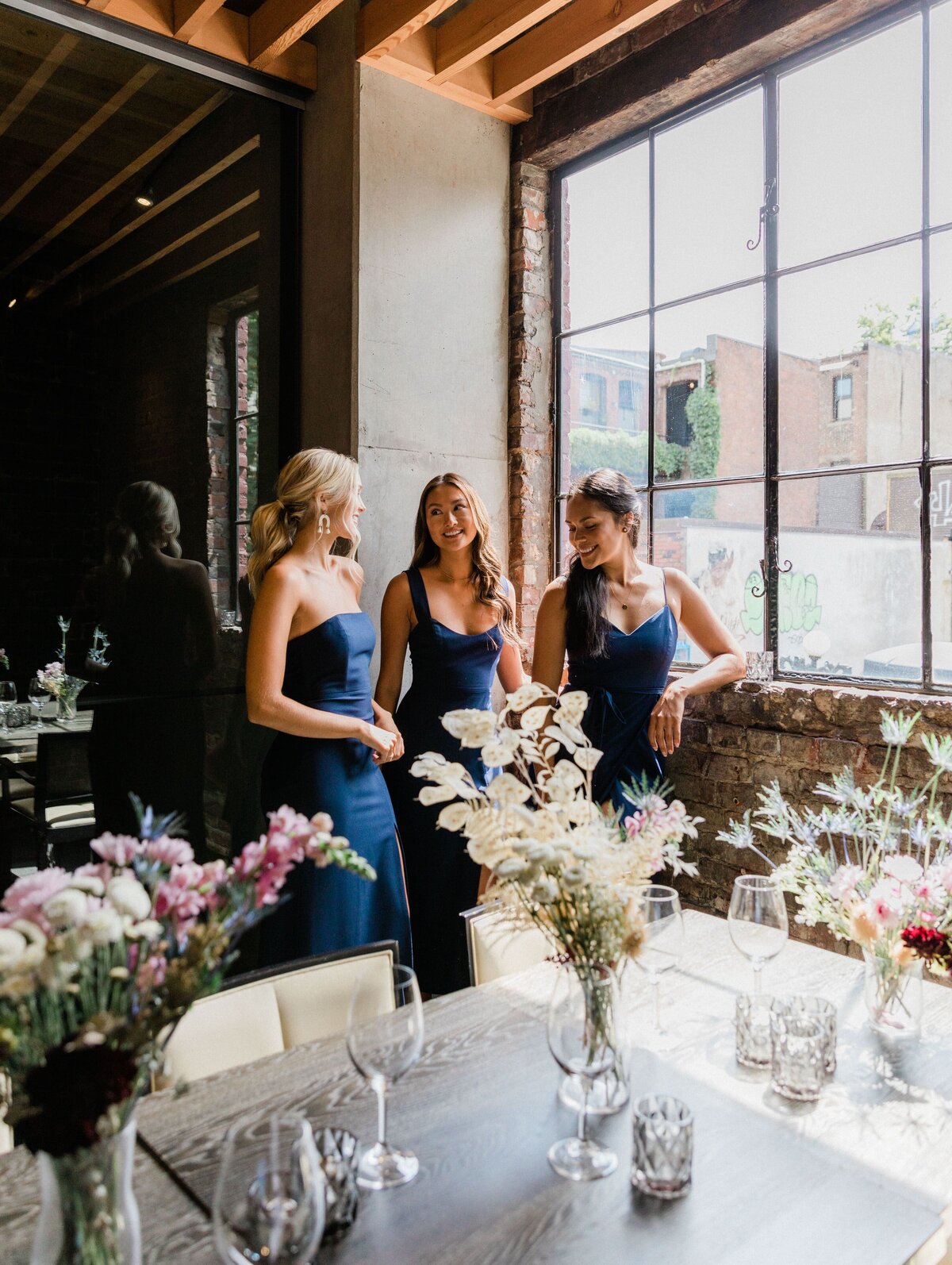 Classic navy blue bridesmaid dresses from Park & Fifth, a modern bridal boutique based in Calgary, Alberta. Featured on the Brontë Bride Vendor Guide.