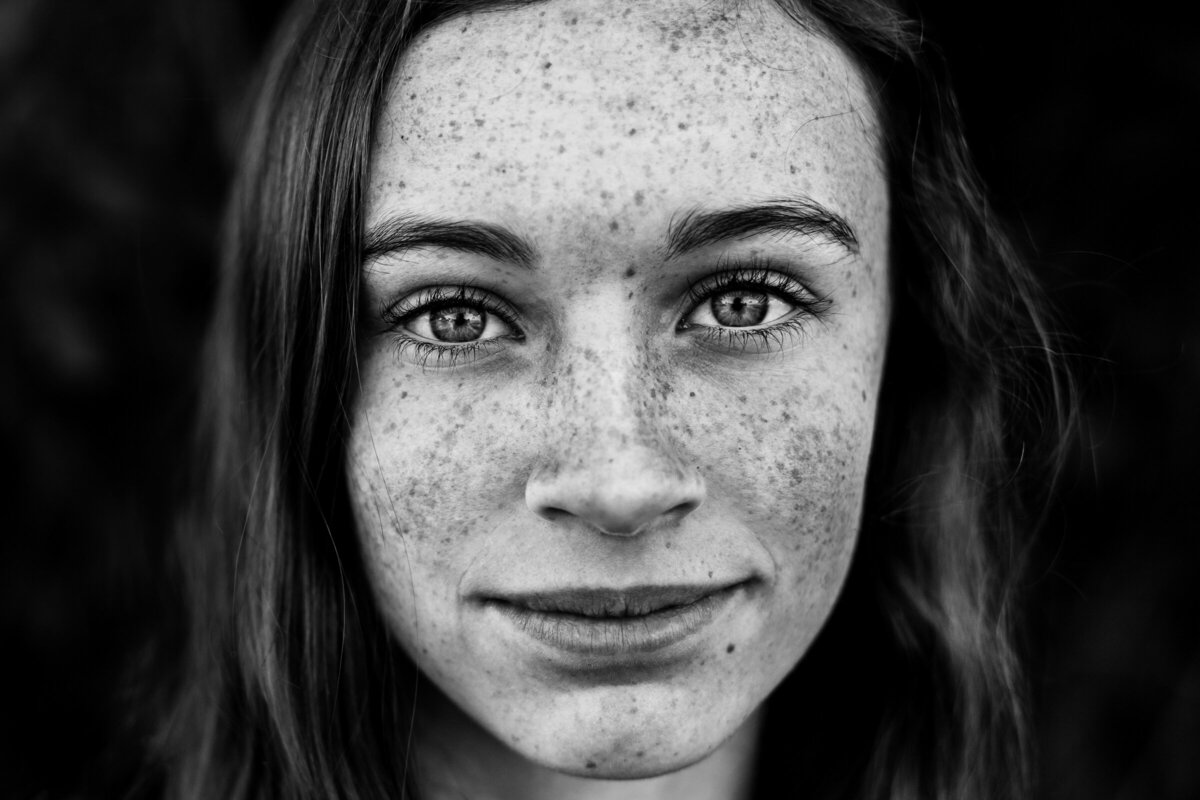closeup portrait of a woman with freckles