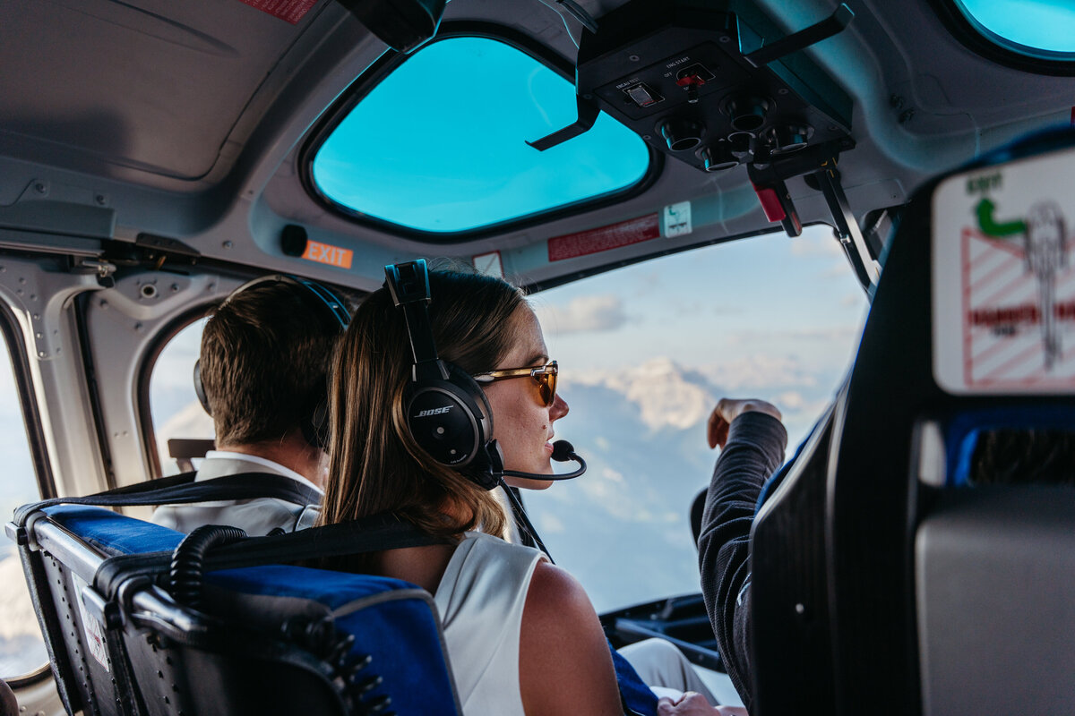 Helicopter flying over Dolomites peaks