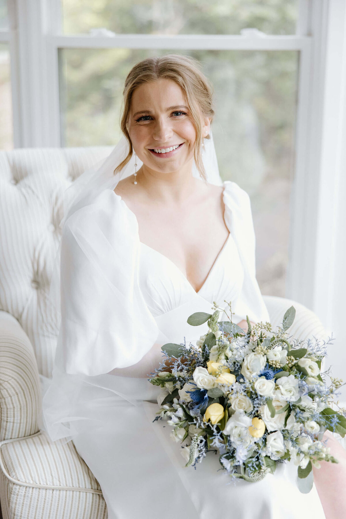 summer bridal portraits of bride in traditional white wedding dress