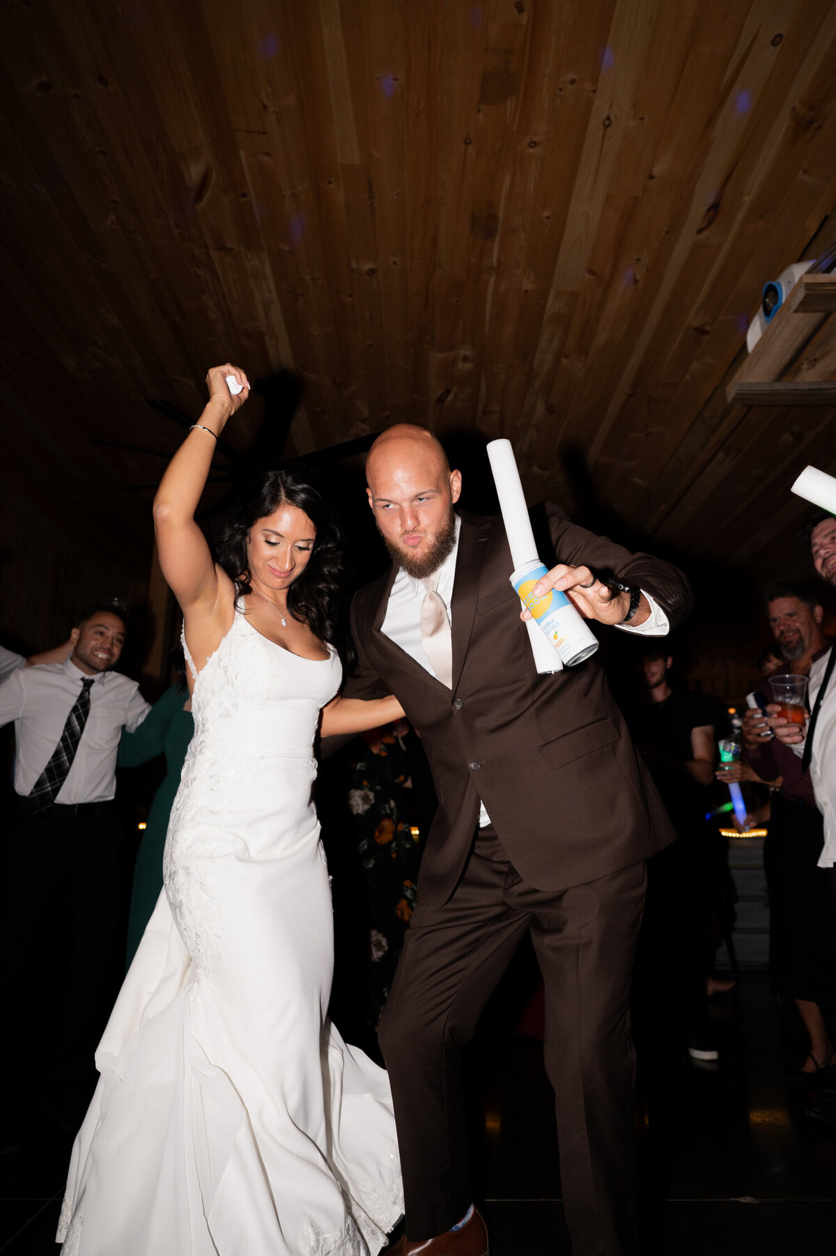 The bride and groom break it down on the dance floor during a wedding at Knotting Hill Farm in Jordanville, NY.