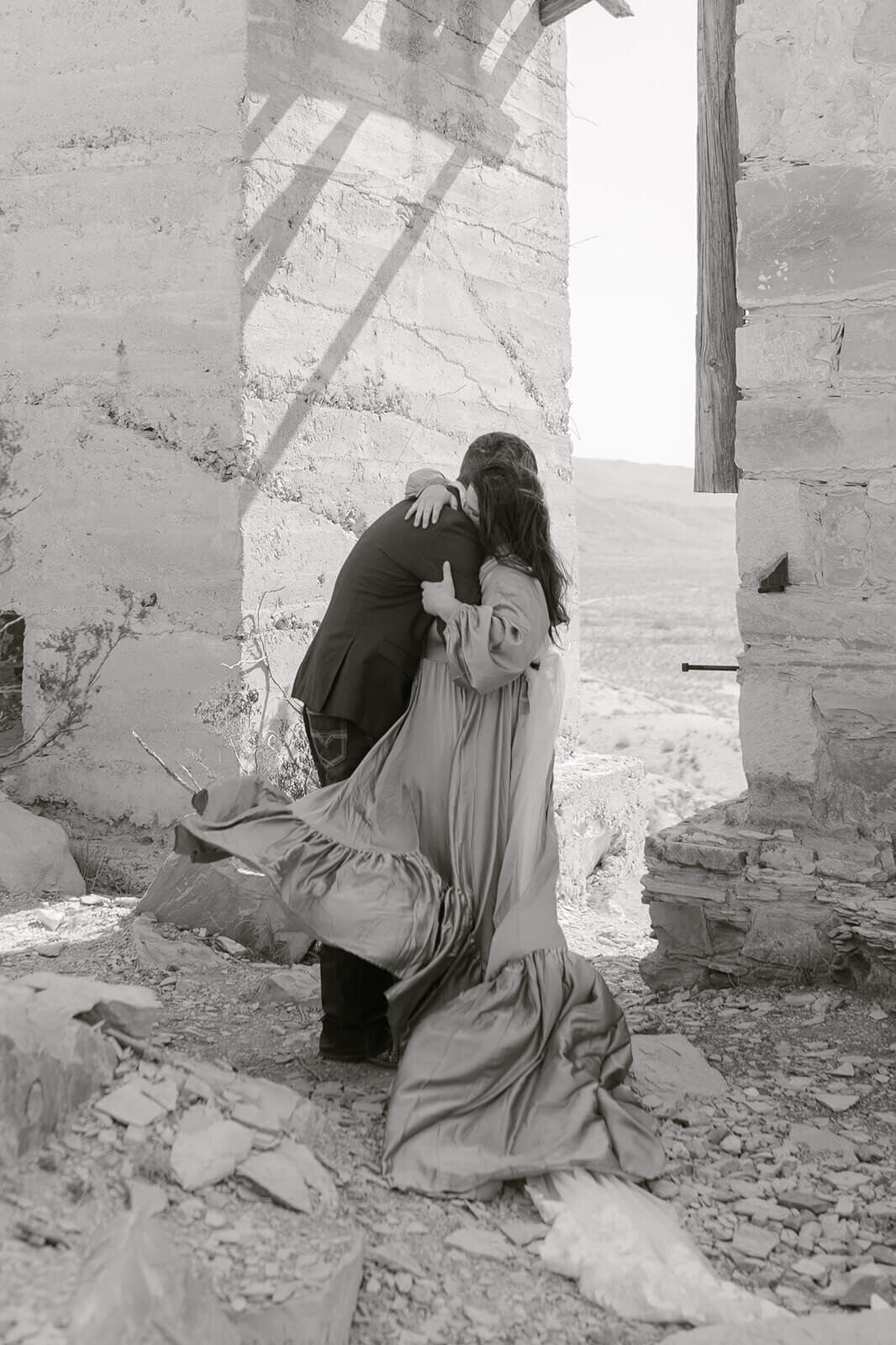 windswept couple hugging