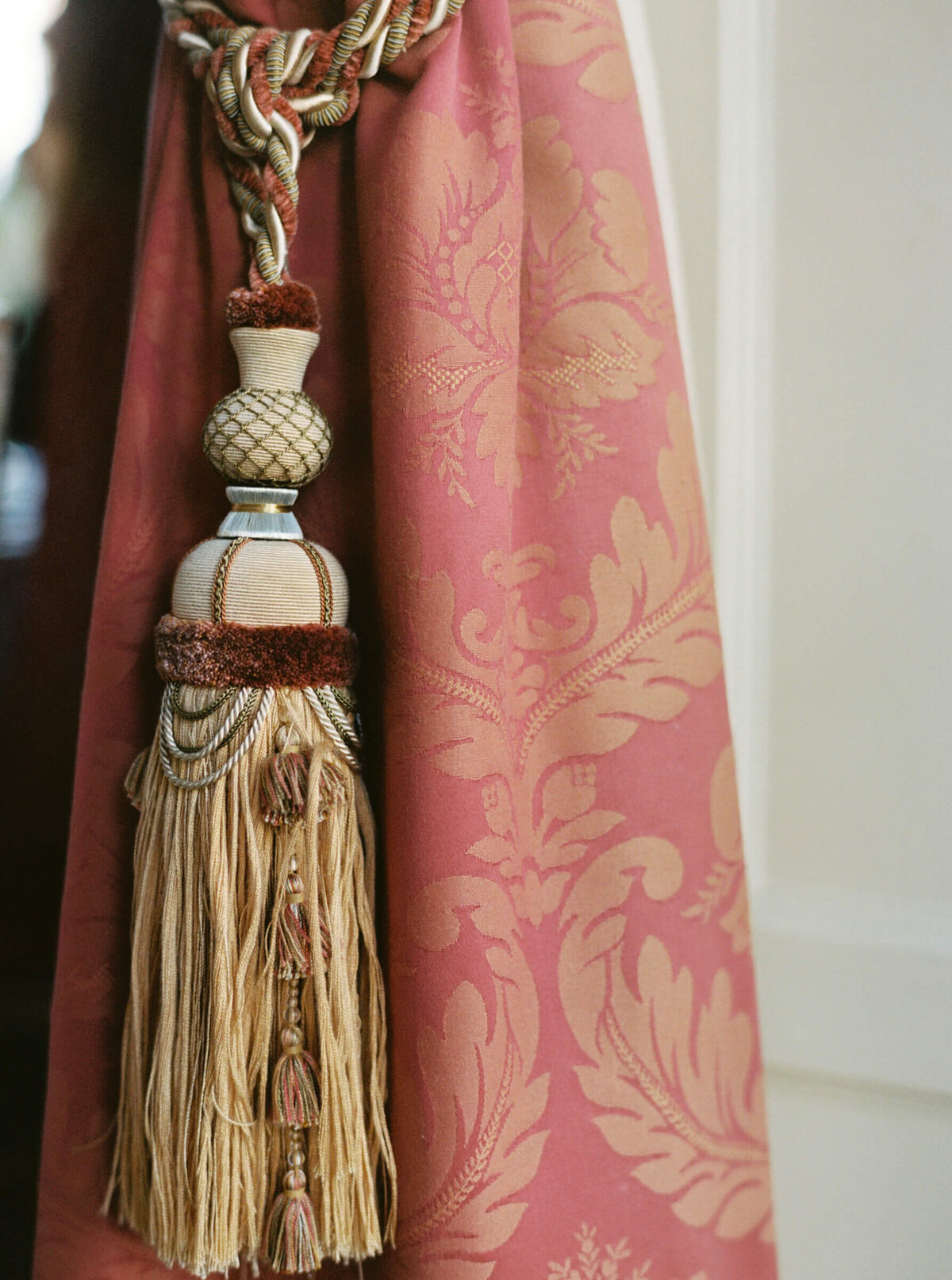 A wedding photo of the detailed curtains in the reception hall at Luttrellstown Castle