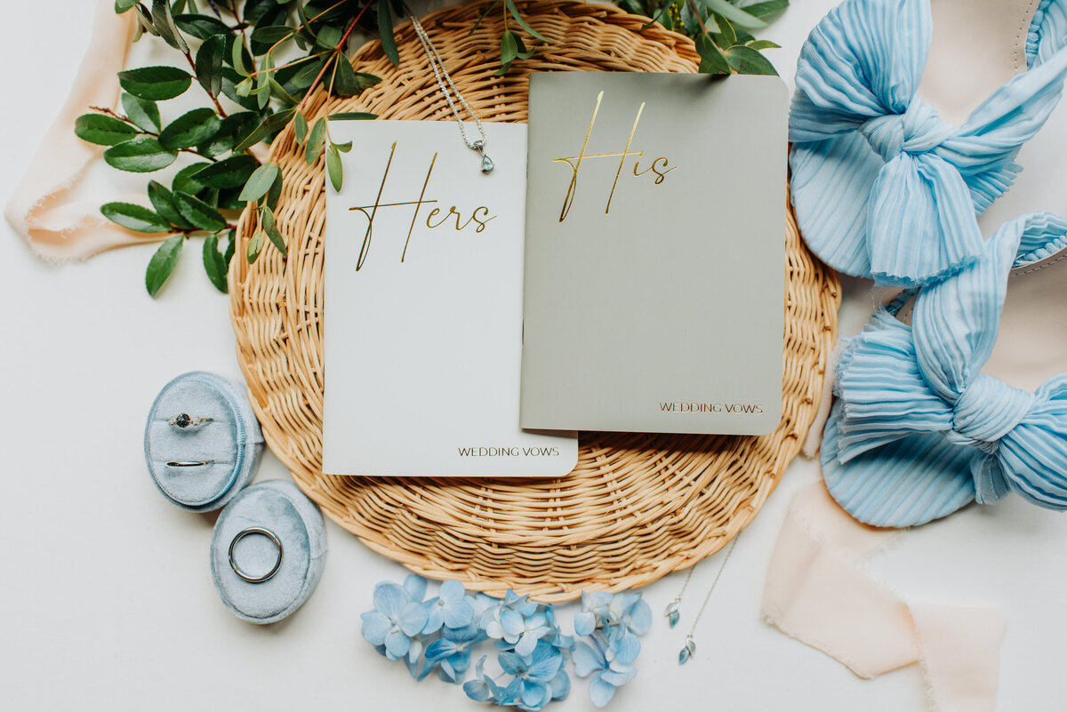 Close up of vow books and jewelry