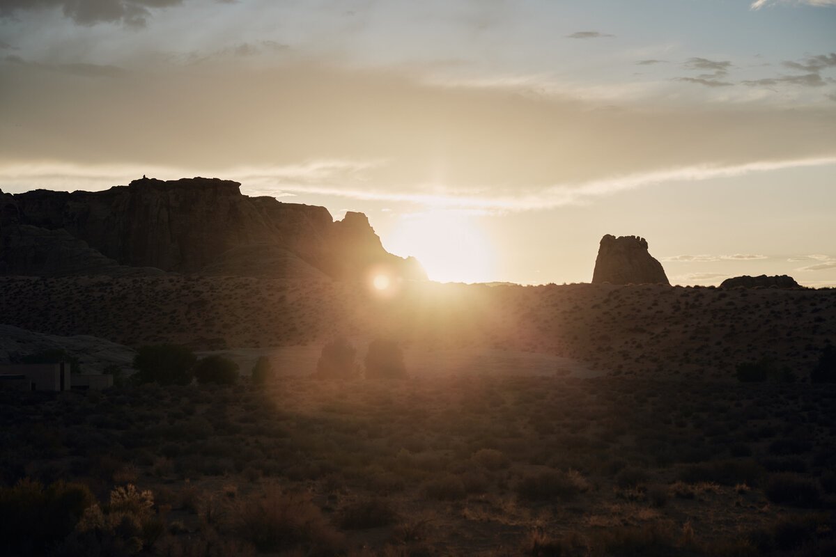 Sun setting over rock formations at Amangiri Utah