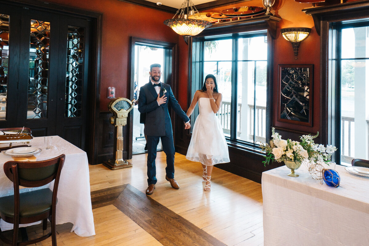 Couple enters wedding reception at The Boathouse in Disney Springs