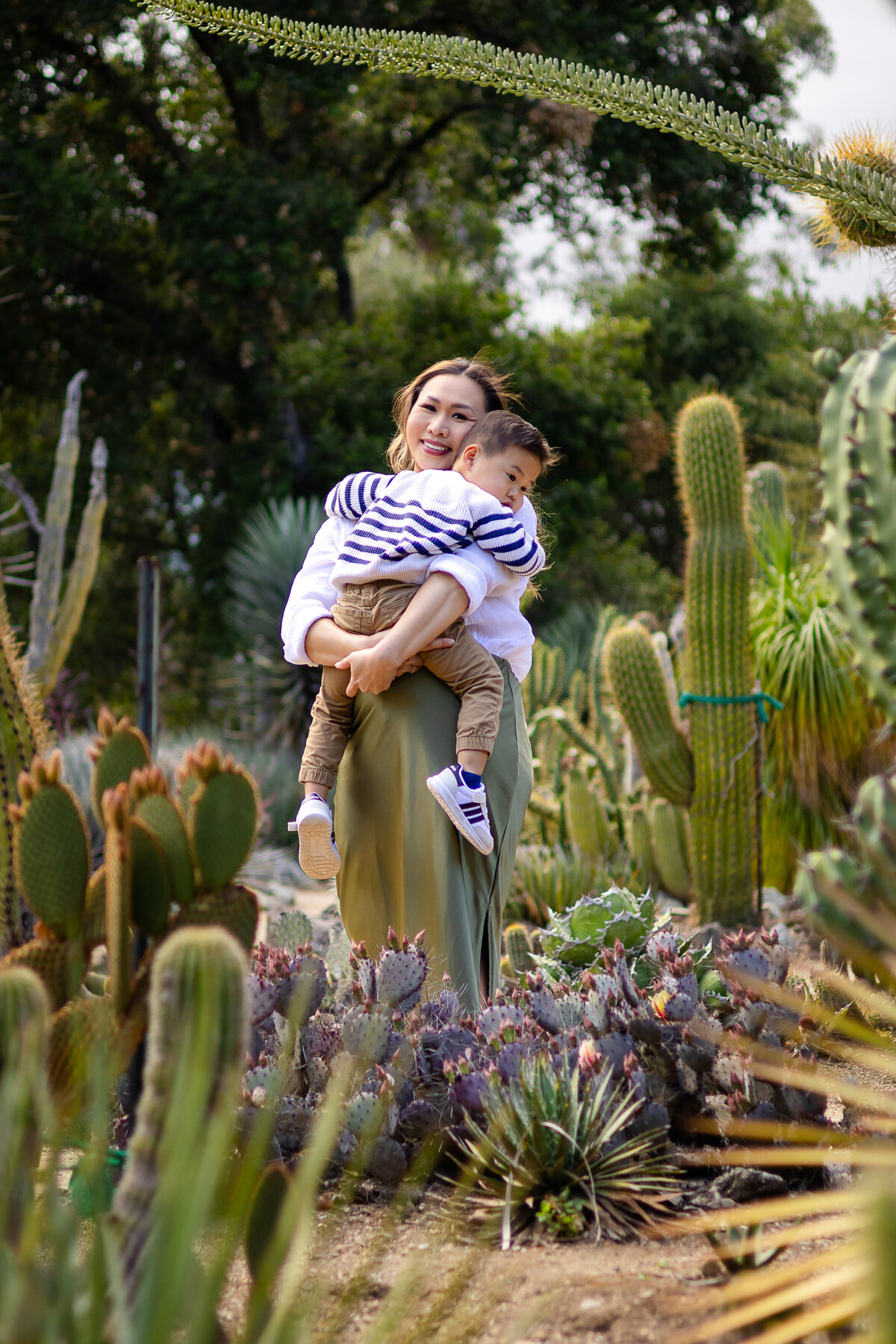 Mom and her toddler son during a playful family photo session  – Ellobelle Photography, lifestyle family photographer on the San Francisco Peninsula Stanford cactus garden Arizona Garden palo Alto