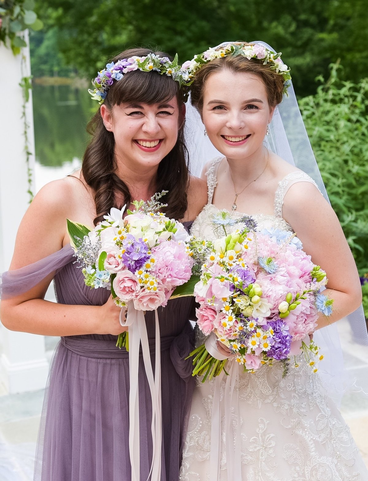 Bride and bridesmaids with pastel bouquets and matching flower crowns for a backyard wedding in spring