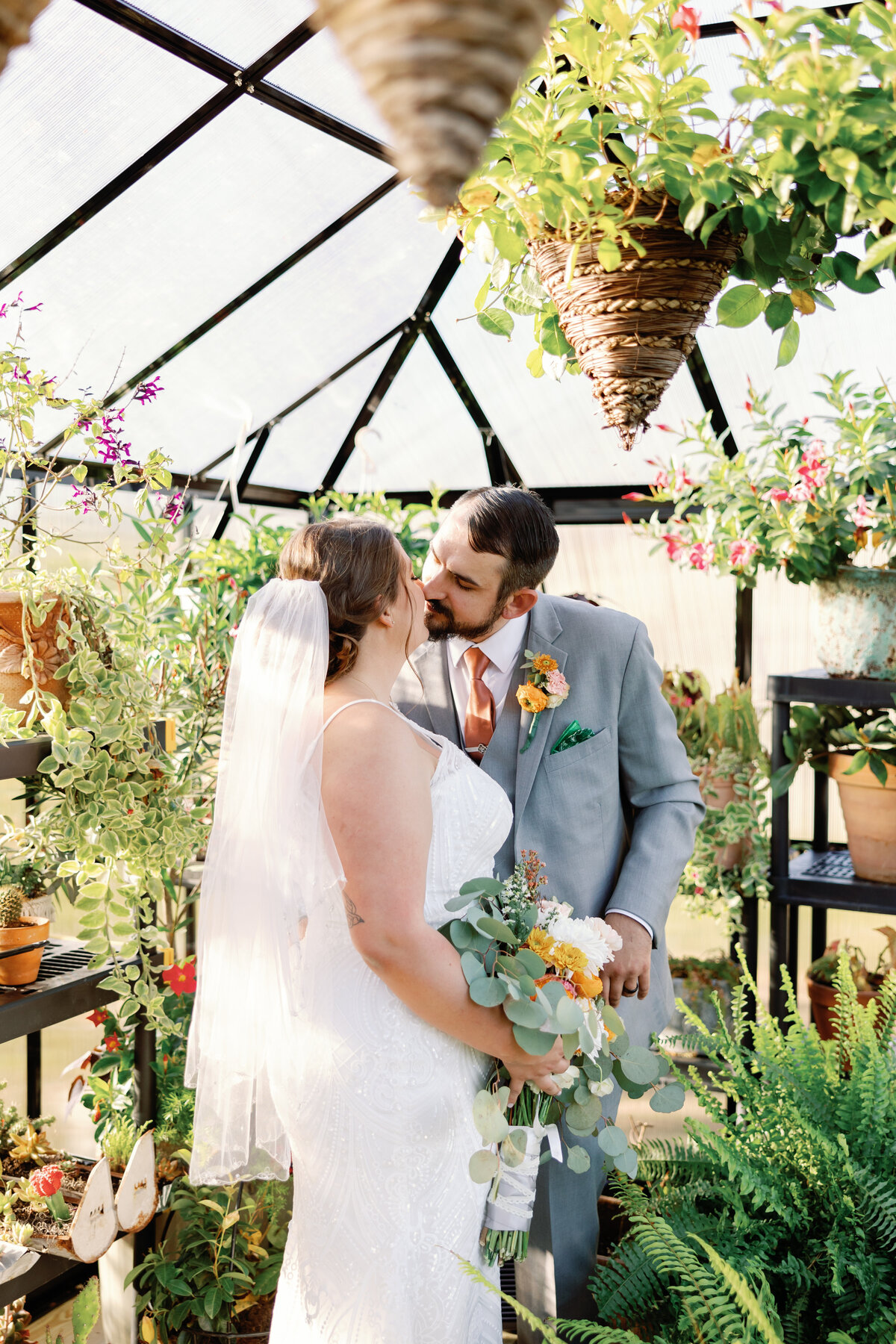 A bride and groom lean in for a kiss at Carolina Home and Gardens in Newport North Carolina
