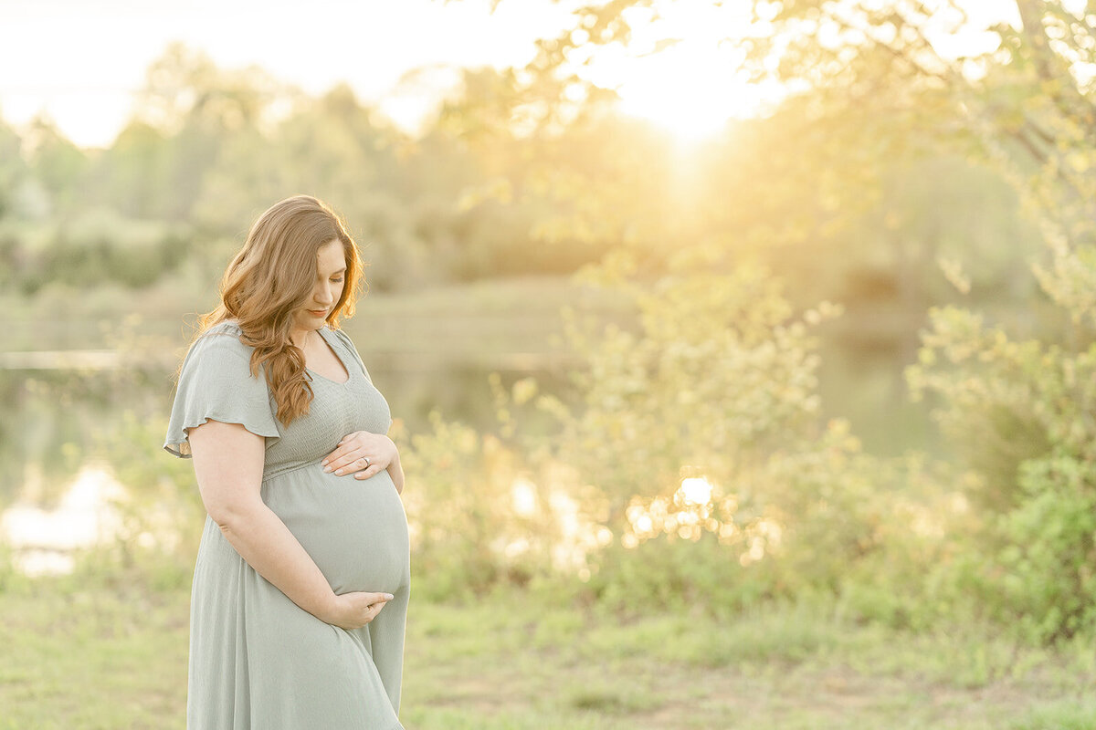first time mom with the sunset glow during maternity photo in Arlington, VA