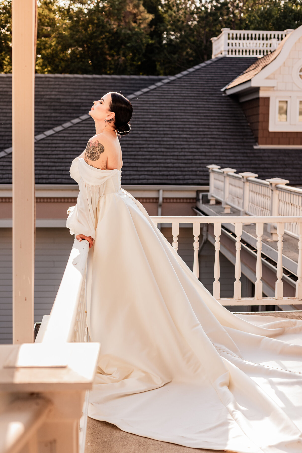 Bride soaks in the sun on a balcony at the Norland Estate
