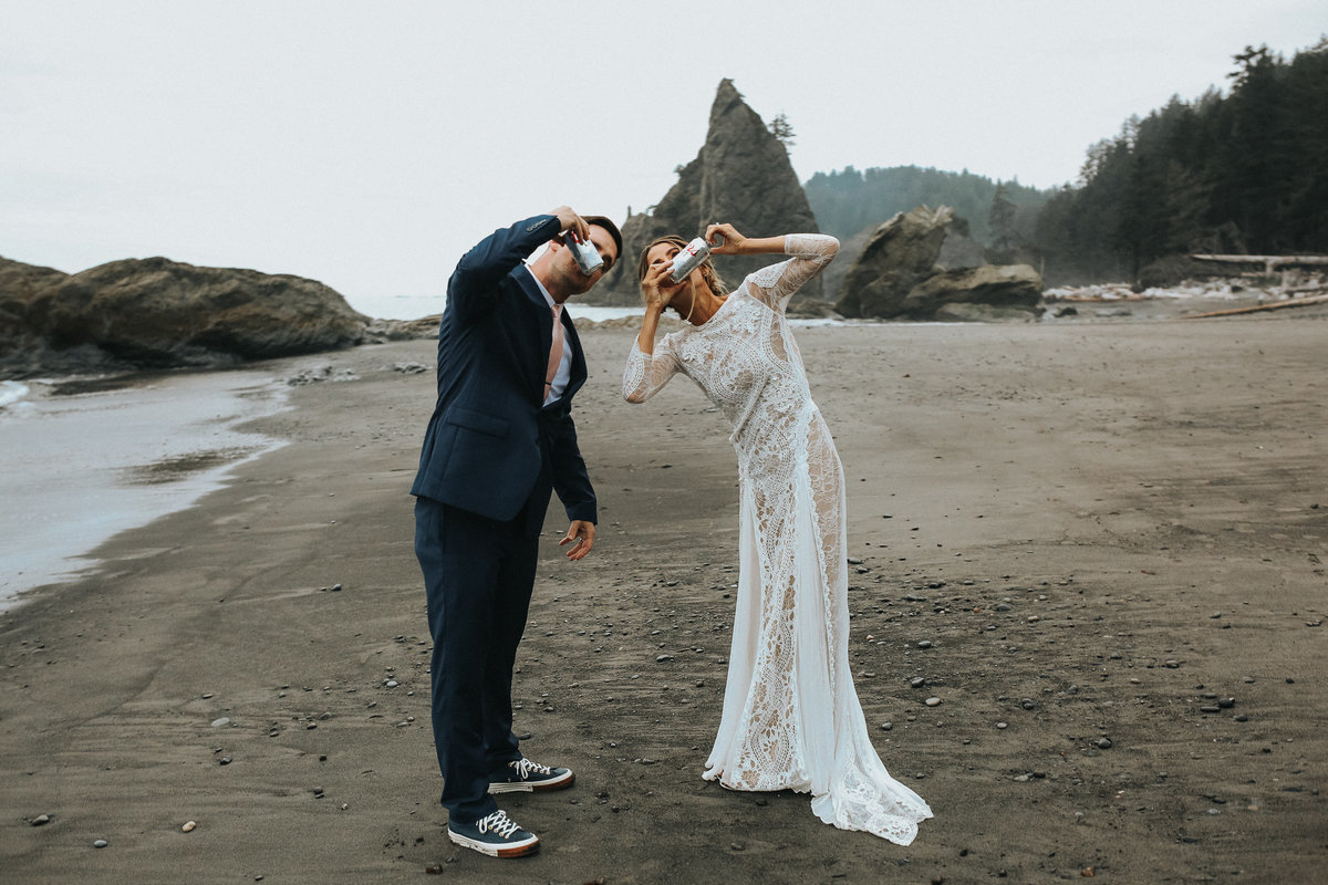 Bride and groom shotgun beer during their elopement at Rialto Beach in La Push Washington