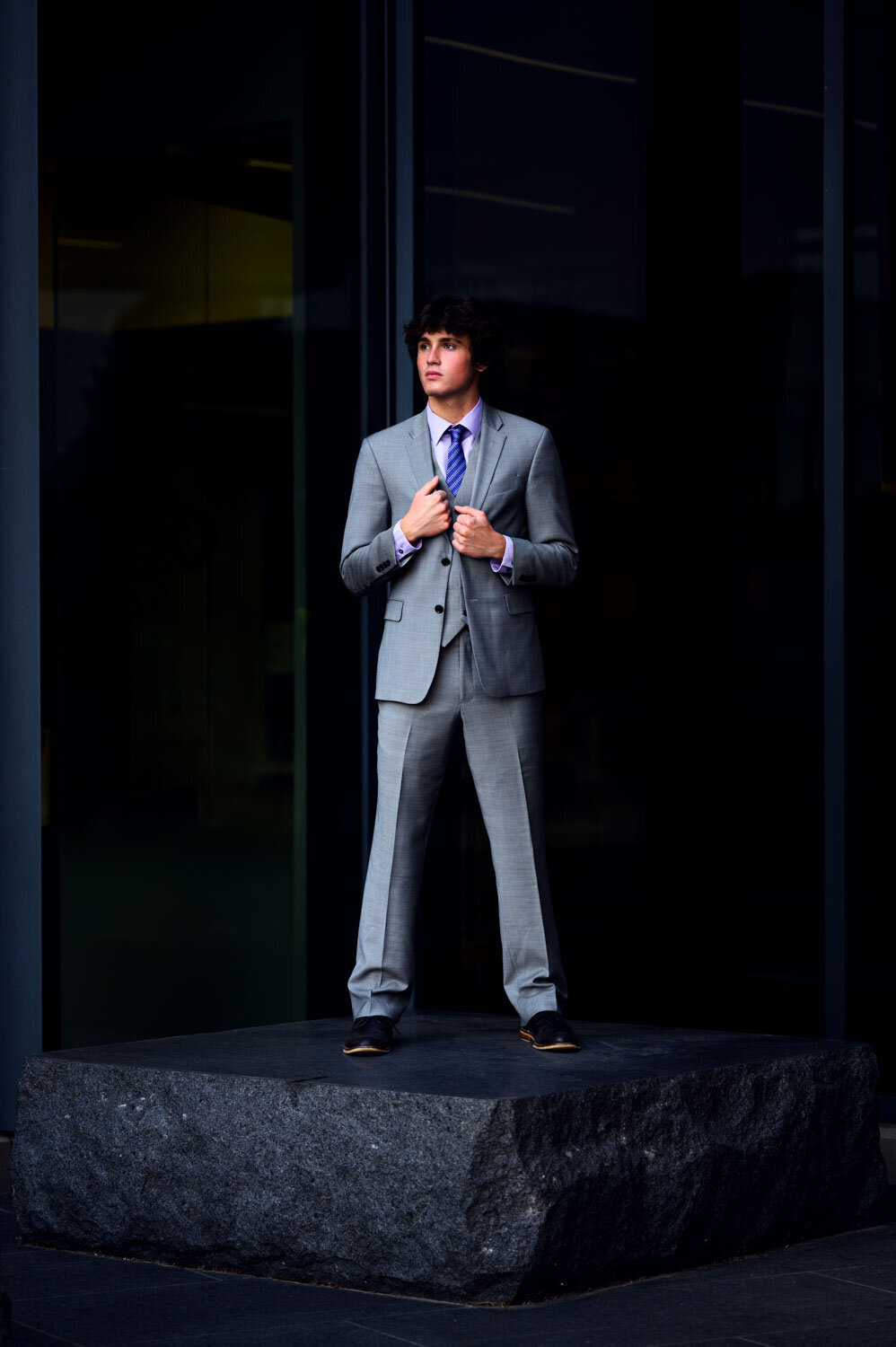 GUY STANDING IN SUIT