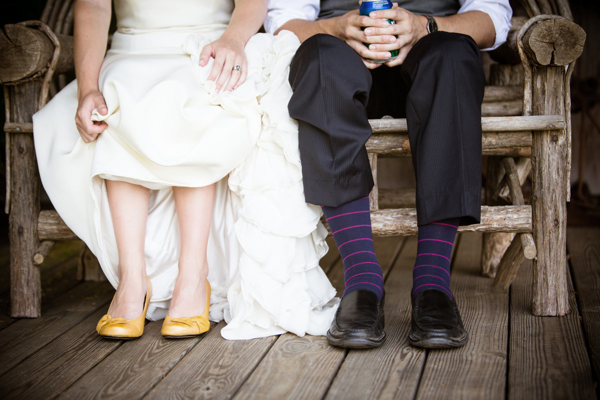 Detail shot of the couple's shoes as they sit before their wedding.