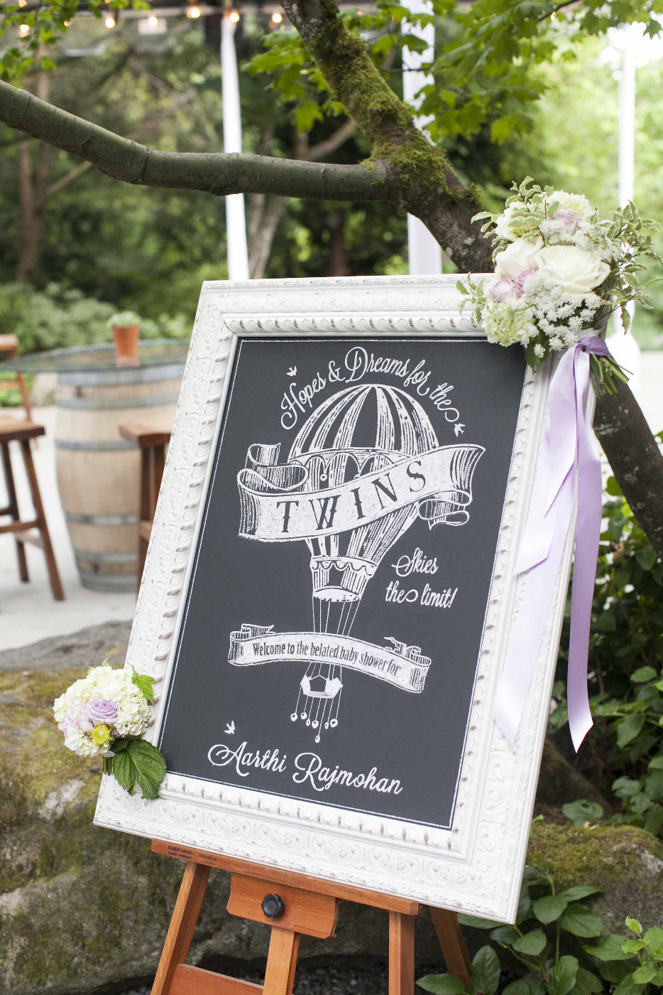 chalkboard signage for twin baby shower with hot air balloon and white frame